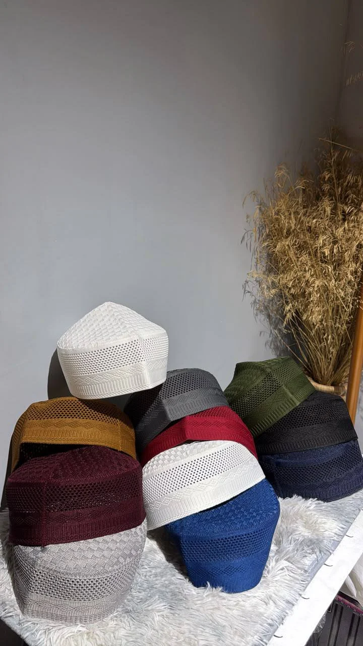 Mina’s Loom caps in burgundy, blue, white, grey, green, and black